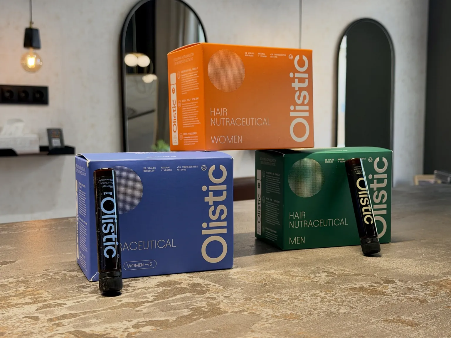 Olistic Women, Next +45 and Men drinkable supplements with their vials at Milanocenter Estilismo, Elche